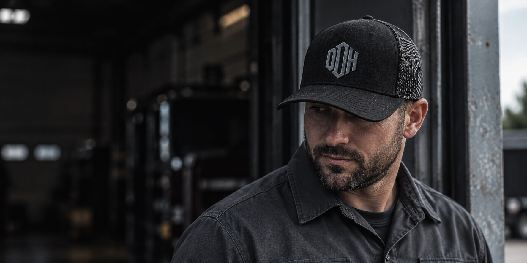 Person wearing a black On Duty Hats trucker hat